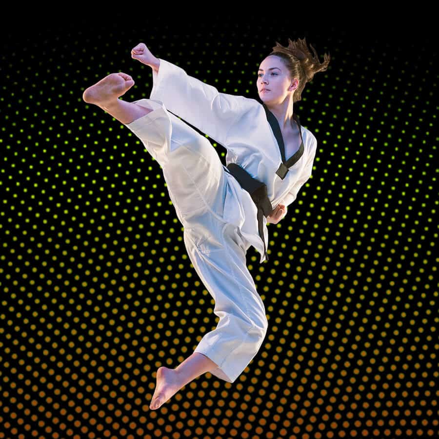 Martial Arts Lessons for Adults in Ramsey NJ - Girl Black Belt Jumping High Kick